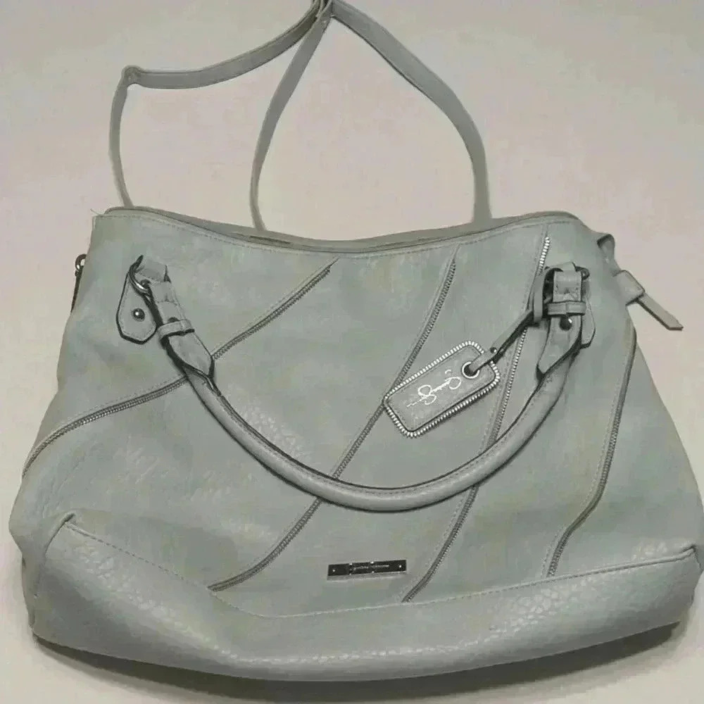 Jessica Simpson purse like new. 10” tall x 15” wide. Blue Color.